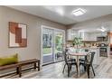 Bright dining area with sliding glass doors offers easy access to the backyard and patio at 8696 E Easter Ave, Centennial, CO 80112