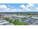 Expansive aerial view showing nearby commercial buildings and parking, situated near a residential area at 364 S Ironton St # 425, Aurora, CO 80012