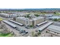 An aerial perspective showcasing an apartment complex with ample parking and convenient covered parking spaces at 364 S Ironton St # 425, Aurora, CO 80012