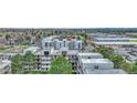 An aerial shot capturing a residential complex with vibrant trees and a mix of commercial and residential surroundings at 364 S Ironton St # 425, Aurora, CO 80012