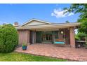 Spacious brick patio with covered area and porch swing offering a relaxing outdoor living space at 2800 S University Blvd # 1, Denver, CO 80210