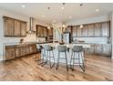 Spacious kitchen with granite countertops, stainless steel appliances, and a large center island with bar seating at 12953 Bridge View Ln, Parker, CO 80134