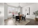 Bright dining room with round wooden table and four chairs at 63 S Jackson St, Denver, CO 80209