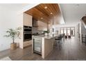 Modern kitchen with large island and wine cooler at 63 S Jackson St, Denver, CO 80209