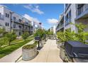 Outdoor grilling area with picnic tables and planters at 2525 Arapahoe St # Rd108, Denver, CO 80205