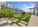 Communal courtyard with lawn, trees, and walkway at 2525 Arapahoe St # Rd108, Denver, CO 80205