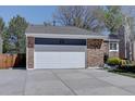 A well-maintained two-car garage enhances the curb appeal of this inviting home at 8745 W Ottawa Ave, Littleton, CO 80128