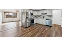 Modern kitchen featuring stainless steel appliances, white cabinetry, and sleek countertops at 235 N 12Th Ave, Brighton, CO 80601