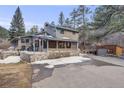 Charming two-story home with stone accents, a spacious driveway and mountain views at 11531 S Deer Creek Rd, Littleton, CO 80127