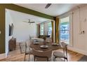 Bright dining area with hardwood floors and seating for four; ideal for enjoying meals and entertaining guests in style at 3726 N High St, Denver, CO 80205