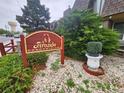 Exterior shot of the Fireside Condominiums sign with landscaped rocks, greenery, and community sign at 8330 Zuni St # 117, Denver, CO 80221