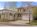 Beautiful two-story home featuring a three-car garage and well-maintained landscaping at 15252 W Warren Dr, Lakewood, CO 80228