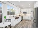 Modern kitchen with white cabinets and copper sink at 426 Knox Ct, Denver, CO 80204