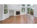 The living room is spacious and features a fireplace and sliding glass doors to the backyard at 5190 Buckingham Rd, Boulder, CO 80301