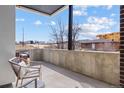 Outdoor patio space offering city views on a sunny day at 1250 Yates St, Denver, CO 80204