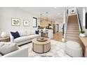 Bright living room with modern decor, light wood floors, and an open layout leading into the kitchen at 1735 Lowell Blvd, Denver, CO 80204