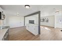 Bright living room with hardwood floors, white walls, and a view to the living room at 1524 Twin Sisters Dr, Longmont, CO 80504