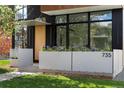 Modern home showcasing a well-kept front entrance with contemporary planters at 735 S Elizabeth St, Denver, CO 80209