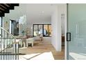 Bright, modern living room with open floor plan and beautiful hardwood floors at 735 S Elizabeth St, Denver, CO 80209