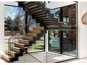 Modern staircase with glass partitions and an abundance of natural light at 735 S Elizabeth St, Denver, CO 80209