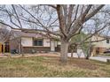 Charming single Gathering home featuring brick accents and a well-maintained front yard at 15155 E Bails Pl, Aurora, CO 80012