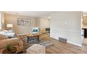 Comfortable living room with modern decor, hardwood floors, and ample natural light at 15155 E Bails Pl, Aurora, CO 80012