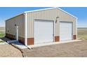 Front exterior of detached garage featuring two-car access at 62681 E Hampden Pl, Byers, CO 80103