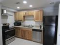 Updated kitchen with stainless steel appliances and light wood cabinetry at 9725 E Harvard Ave # 346, Denver, CO 80231