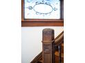 Close-up of decorative carved post with wooden staircase at 3905 Tejon St, Denver, CO 80211