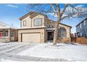 Charming two-story home featuring a two-car garage and landscaped yard at 9421 Morning Glory Ln, Highlands Ranch, CO 80130