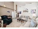 Spacious living room featuring neutral walls, plush carpet, and comfortable seating arrangement at 9421 Morning Glory Ln, Highlands Ranch, CO 80130