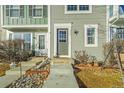 Townhome entrance with walkway and landscaping at 19921 Victorian Way, Parker, CO 80138