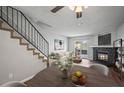 Living room with fireplace and access to patio at 19921 Victorian Way, Parker, CO 80138