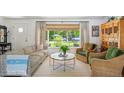 Bright living room featuring stylish furnishings, a large window, and lots of natural light at 225 N Ivanhoe St, Denver, CO 80220