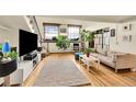 Cozy living area with a large rug, comfortable seating, and plenty of natural light at 2351 Federal Blvd # 401, Denver, CO 80211