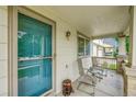 Inviting covered front porch with seating area, perfect for relaxing and enjoying the neighborhood view at 11285 Iola St, Commerce City, CO 80640