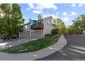Attractive condo featuring a balcony, well-maintained lawn, and a two-car garage in a desirable community at 1470 S Quebec Way # 245, Denver, CO 80231