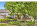 Inviting exterior showcases lush landscaping, brick details, and a well-maintained facade at 2980 W Long Dr # E, Littleton, CO 80120