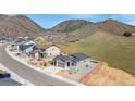 Desirable home exterior with a finished yard, xeriscaping and mountain views at 4706 Mesa Top Dr, Monument, CO 80132