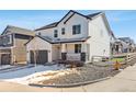 Beautiful two-story house featuring a covered porch and a well-maintained front yard in winter at 2548 Horsehound Pl, Castle Rock, CO 80104