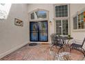 Elegant entry with double doors, stylish patio set and well-lit with natural light from transom windows at 6328 S Ouray Way, Aurora, CO 80016