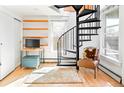 Unique space with a spiral staircase, hardwood floors, and a sunny window at 3521 W 40Th Ave, Denver, CO 80211
