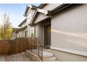 Inviting home entrance with a decorative wreath, complemented by manicured landscaping at 2434 S Williams St, Denver, CO 80210