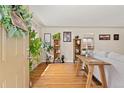 Bright living room with hardwood floors, stylish decor, and an open doorway at 1432 Xanthia St, Denver, CO 80220