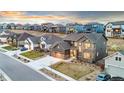 Charming home boasts modern design, well-kept lawn, driveway, and blends seamlessly into its vibrant neighborhood setting at 18267 W 95Th Ave, Arvada, CO 80007