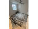 Bedroom featuring a ceiling fan and a rug with a gray pattern at 201 S Monmouth Ave, Firestone, CO 80520