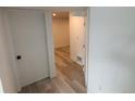 Hallway featuring wood-look flooring at 201 S Monmouth Ave, Firestone, CO 80520
