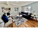 Cozy living room showcasing stylish furniture, area rug, and abundant natural light at 601 W Layton Ave, Englewood, CO 80110