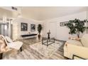 Cozy living room with stylish decor and neutral walls, complete with a soft rug and ample seating at 6800 E Tennessee Ave # 111, Denver, CO 80224