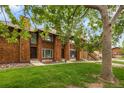Charming townhomes with cedar siding, lush front lawns and mature shade trees at 1264 S Crystal Way, Aurora, CO 80012